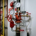 Wet alarm valve station